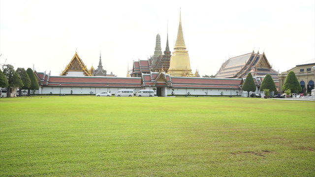 Wat Phra Kaew, Grand palace, Temple of the Emerald Buddha with sky and green lawn. Landmark of Bangkok,Thailand
