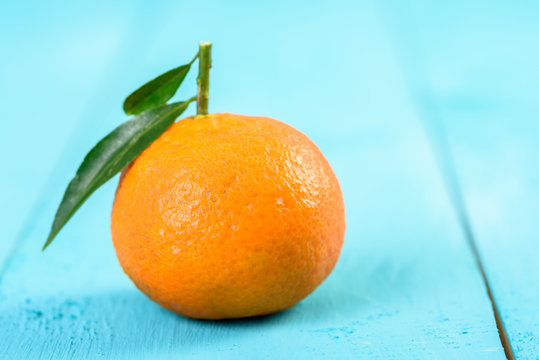 Fresh Tangerine On Blue Table