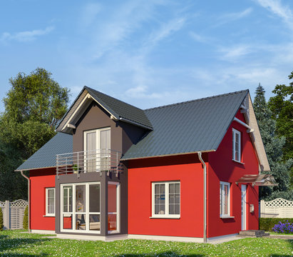 Ein rot-schwarzes Einfamilienhaus in blühender Natur.