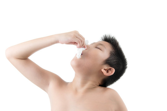 Flu cold or allergy symptom.Sick young asian boy with fever snee
