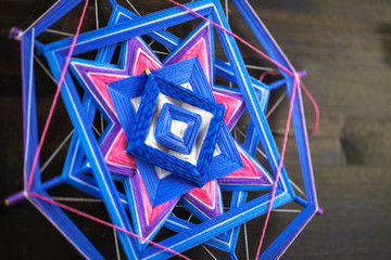 Knitted beautiful mandala. Shallow depth of field. Two knitted tibetan mandala from threads, top...
