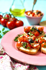Crostini with tomatoes,feta and olives.