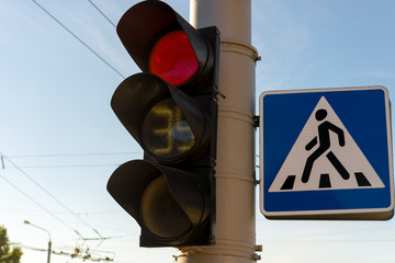 traffic light with a burning red lights in the city