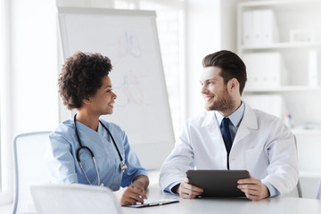 Fototapeta premium two happy doctors meeting at hospital office