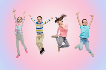 happy little children jumping in air