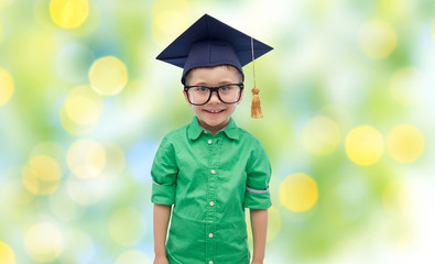 happy boy in bachelor hat or mortarboard