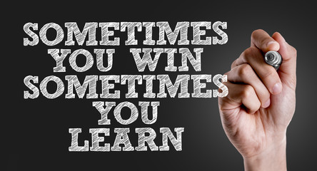 Hand writing the text: Sometimes You Win Sometimes You Learn