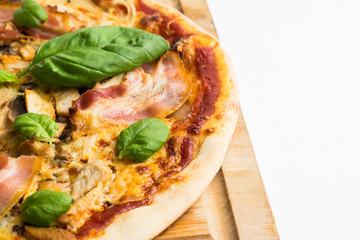 Fresh pizza served on wooden table