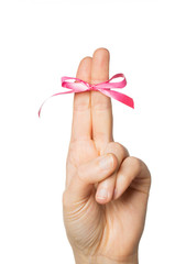 close up of two fingers tied by pink bow knot