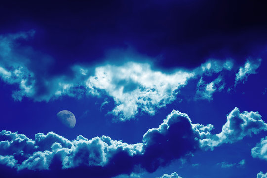 Blue clouds and moon background