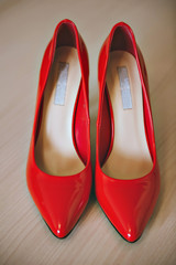 Red women shoes on wooden background