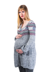 Pregnant woman holding her belly looking at camera isolated on w