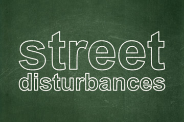 Political concept: Street Disturbances on chalkboard background