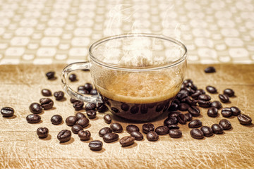 cup of coffee with coffee grains