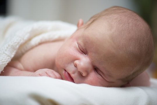 Adorable beautiful newborn baby girl. Maternity and newborn concept. Newborn baby is sleeping