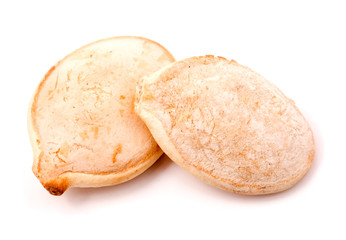two pumpkin seeds on white background macro