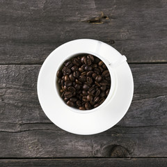 Coffee grains on dark wooden background