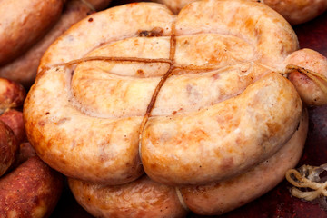 homemade pork sausage, spiral baked close up
