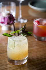 Fresh cocktail with orange, mint and ice, selective focus