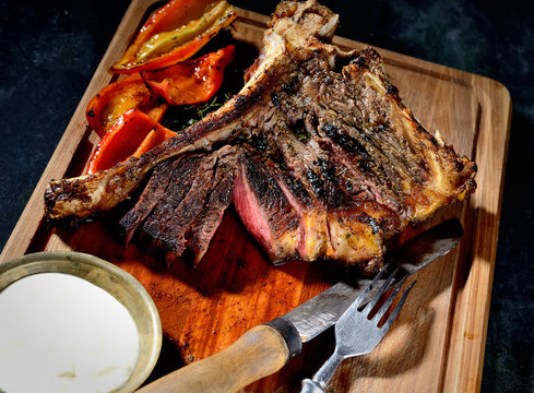 grilled steak on the wooden background