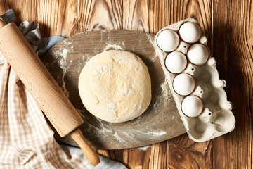 Dough and ingredients on table