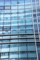 windows of Glass modern office building in business center city,