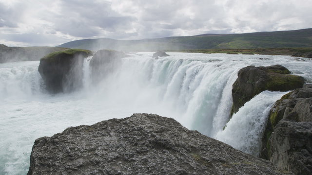 Iceland tourist attraction. Majestic view of powerful Godafoss waterfall. It is a beautiful Icelandic waterfall on the North of island. It is one of the famous tourist destination.
