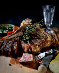 grilled steak on the wooden background
