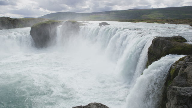 Iceland waterfall. Idyllic view of beautiful Godafoss waterfall. It is a spectacular Icelandic waterfall on the North of island. It is one of the famous tourist attractions. SLOW MOTION RED EPIC.