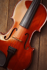 Violin on wooden background