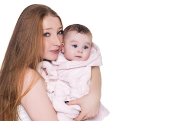 Fototapeta na wymiar loving mother with her cute baby isolated on white. mom holding child in pink bathrobe hood with blue eyes, after shower. happy family concept