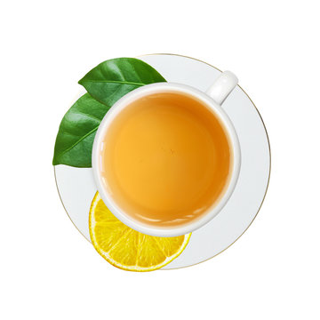 white cup with tea, lemon and green leaves isolated on white