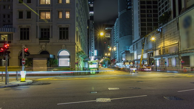 Neon lights on Tsim Sha Tsui street timelapse hyperlapse with traffic near Pehinsula.