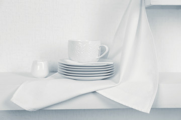 Tableware with napkin on a white background