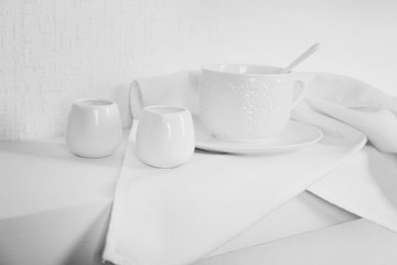 Fototapeta na wymiar Tableware with napkin on a white background, close up