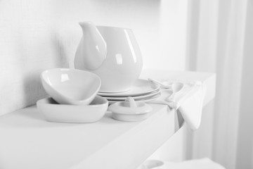 Tableware with napkin on a white background