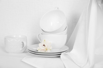 Tableware with napkin on a white background, close up