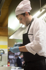 Fototapeta na wymiar young chef cleans shrimp