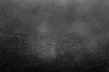 Old scratched and chapped painted dark grey and black wall. Abstract textured background, empty template