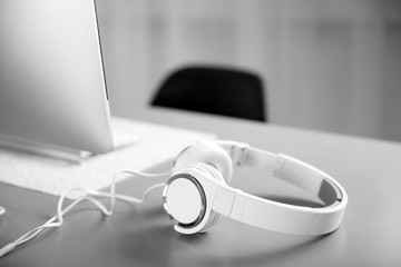 Headphones on gray table against defocused background