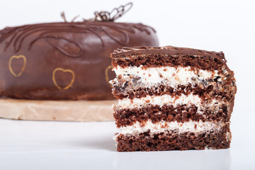 Chocolate homemade cake with gold decor. Shallow depth of field.