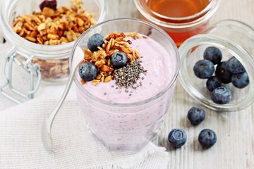 Overnight chia seeds and blueberry yogurt with homemade granola.Healthy eating concept.Selective focus 