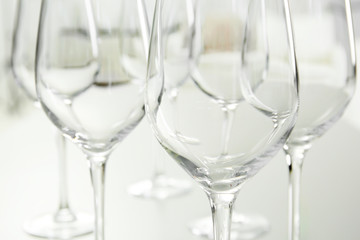 Wineglasses on blurred interior background