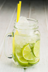 Pitcher refreshing drink with lime