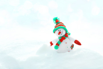 Beautiful snowman on natural snowdrift, close up