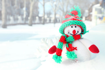 Beautiful snowman on natural snowdrift, close up