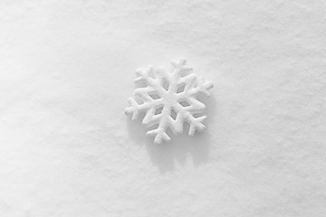 Beautiful snowflake on natural snowdrift, close up