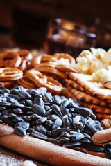 Sunflower seeds roasted salted, a plate of snacks, selective foc