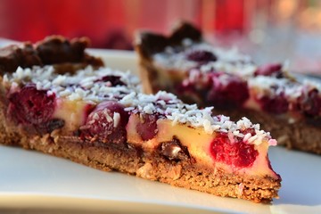 tart with cherries, chocolate, cream, coconut