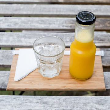 Juice bottle on wood background - Fresh orange juice on wooden